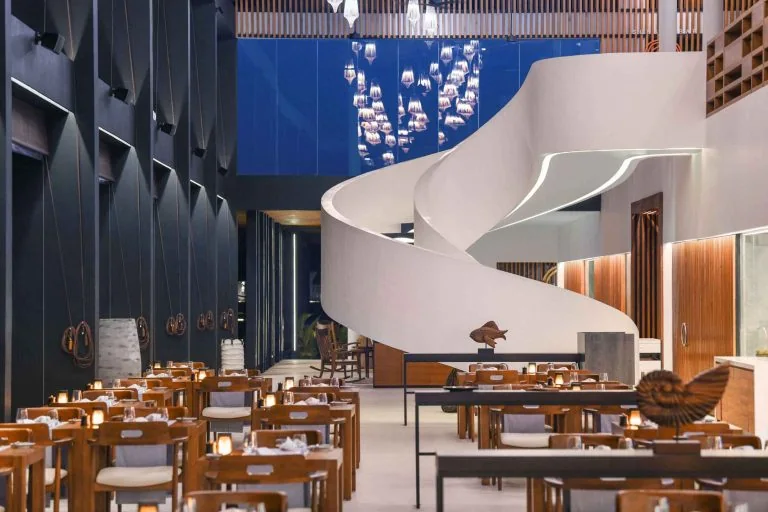 GEORGE Group event dining space with repeated tables and loose chairs