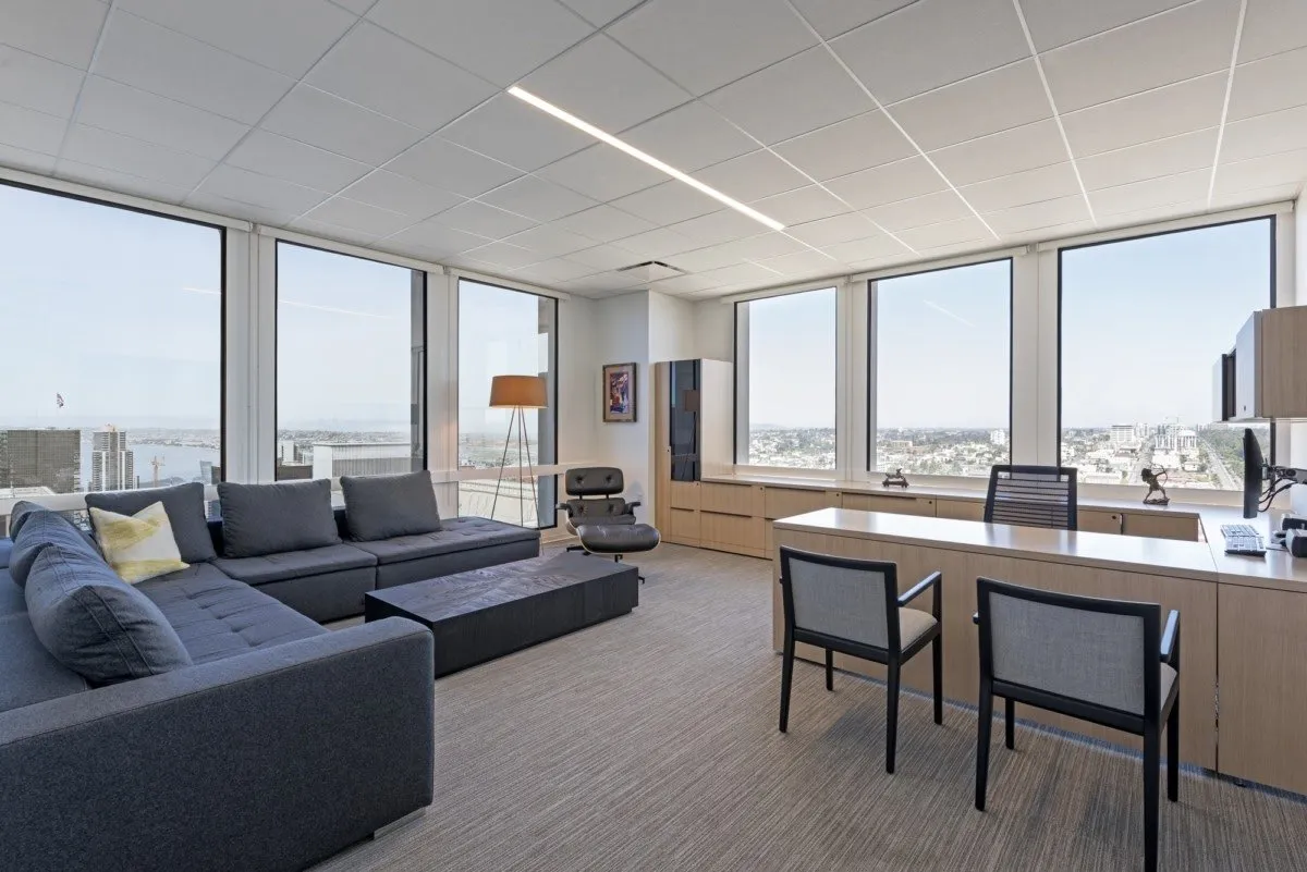 GEORGE Group private office setting with desk, visitor chairs, sofa and storage